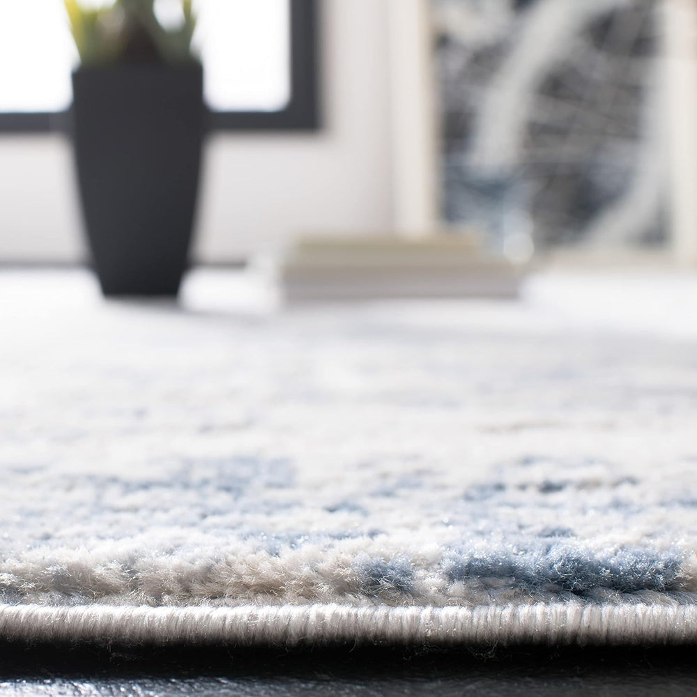SAFAVIEH Amelia Collection Area Rug - 6' x 9', Ivory & Blue, Mode...