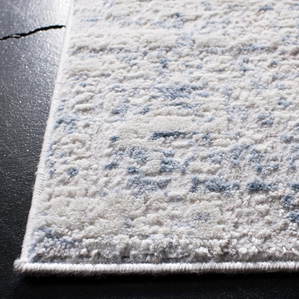 SAFAVIEH Amelia Collection Area Rug - 6' x 9', Ivory & Blue, Mode...
