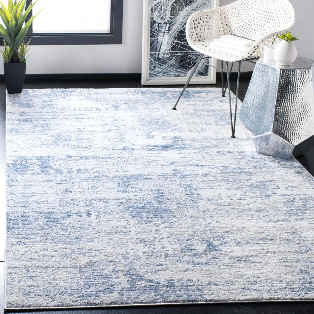 SAFAVIEH Amelia Collection Area Rug - 6' x 9', Ivory & Blue, Mode...